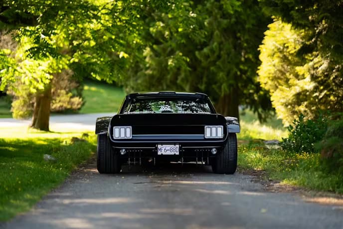 bagged Mustang with aggressive stance and custom bodywork