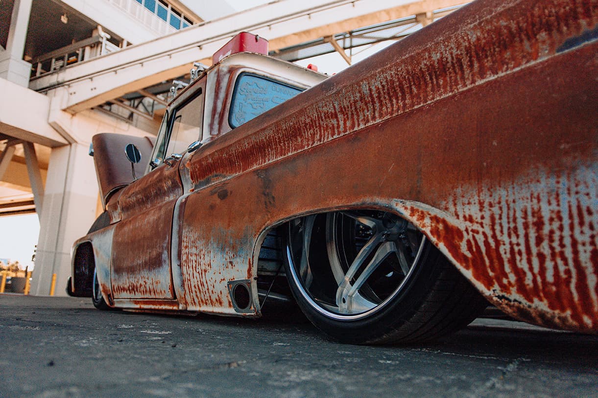 A lowered vehicle equipped with Air Lift Performance at SEMA 2024 in Las Vegas