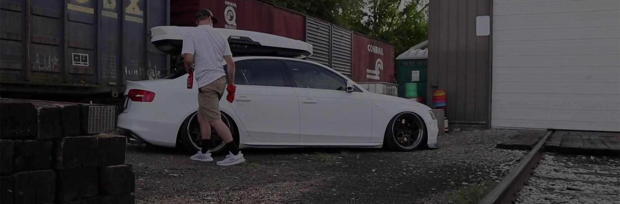 Man inspecting lowered vehicle